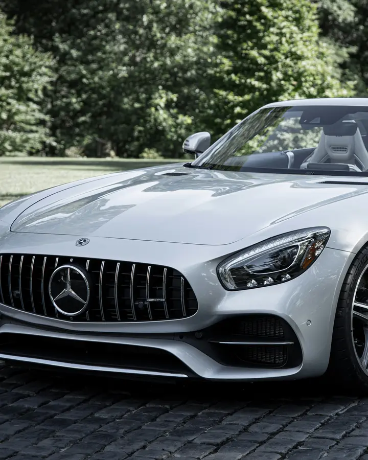 Silver Mercedes-AMG GT Roadster on a cobbled drive